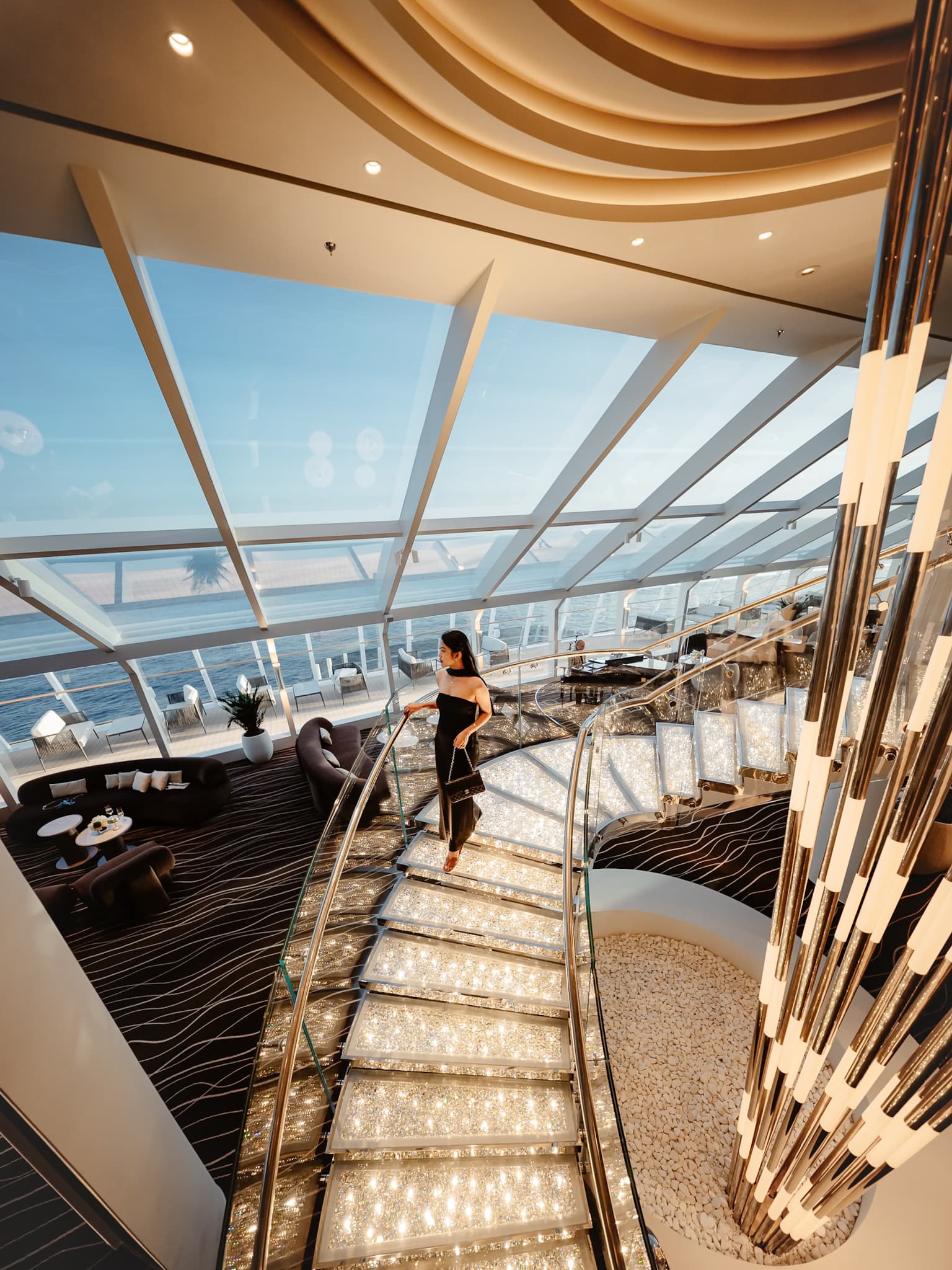 Lumière Pixel co-founder Tram Le on the illuminated yacht-club staircase aboard MSC World America
